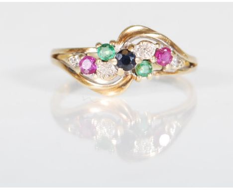 A hallmarked 9ct gold ladies dress ring having a cross over design set with round cut diamond, ruby, sapphire and emerald. Ha