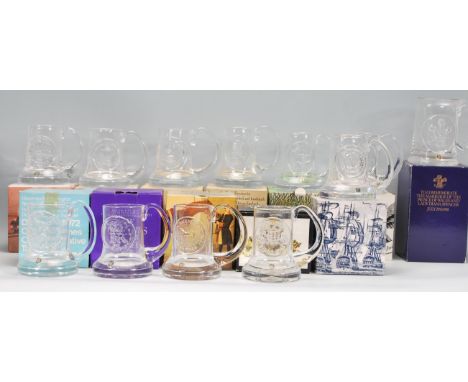 A collection of Dartington Crystal commemorative glassware tankards designed by Frank Thrower. The tankards include United St