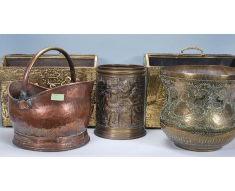 A collection of brass and copper wares to include 2 brass magazine racks, brass cauldron planter, Victorian copper coal scutt