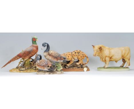 A selection of 20th Century ceramic animals to include a Akita ring-necked pheasant, bull and geese along with a Saxony jagua