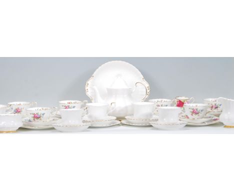 A vintage Royal Albert Val D'or pattern part tea service consisting of tea pot, tea cups, saucers, creamer jug and sugar bowl