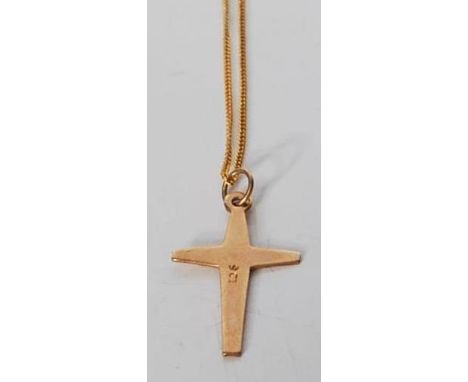 A 9ct yellow gold cross having engraved starlike decoration on a 9ct yellow gold chain. Both marked for 9ct. Total weight 1.4