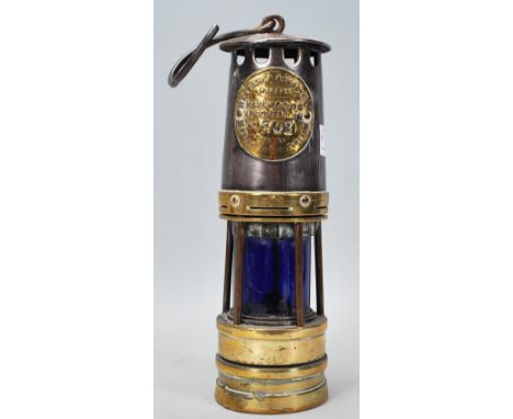 A 19th century Victorian Hailwoods Proved Lamp No 702&nbsp; / miners lamp with brass plaque and blue glass. Hook atop
