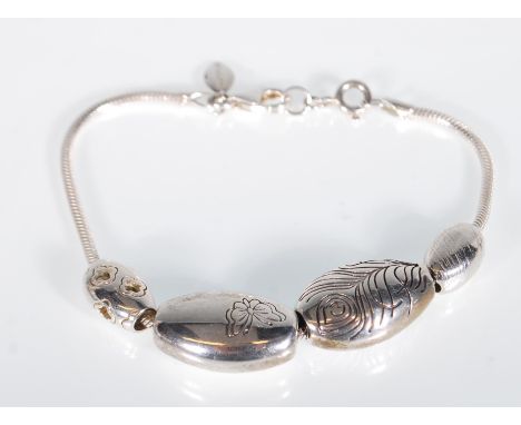 A Sterling silver designer Kit Heath bracelet with gas pipe chain adorned with fish decorated&nbsp; lozenges. Set with lobste