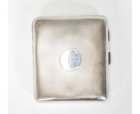 An early 20th Century silver hallmarked William Neale &amp; Son&nbsp;cigarette case having engine turned decoration with a ro