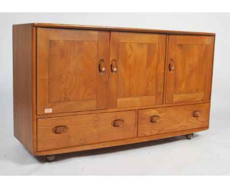 Lucian Ercolani - Ercol - Windsor -A 1960's retro vintage beech wood sideboard credenza having twin door cabinet with third d