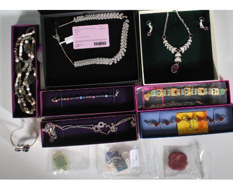 A collection of ladies silver and costume jewellery to include an amethyst silver bangle set with four polished cabochon ston