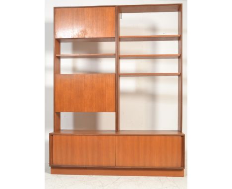 A vintage retro G Plan teak wood red label low side board having sliding inset doors, having two upright shelving units above
