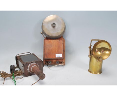 A vintage 20th century Industrial alarm bell together with a brass lamp of cylindrical form and a carriage lamp from a train.