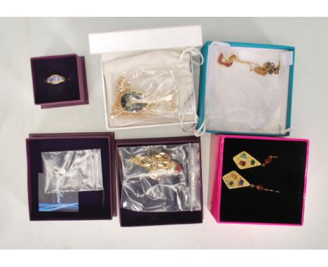 A collection of unused ladies silver dress jewellery to include a gold plated ruby heart pendant necklace, multi gem earrings