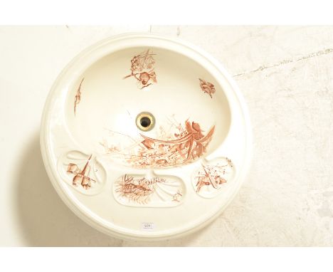 An antique 19th Century Victorian Brown, Westhead, Moore &amp; Co sink / wash basin of round form having transfer printed bir