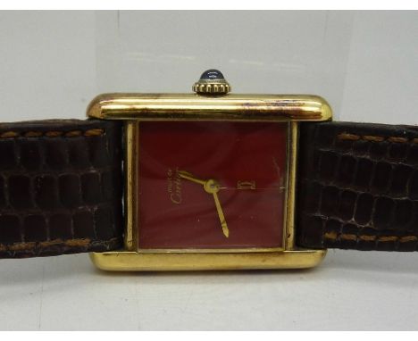 A lady's silver gilt Cartier wristwatch