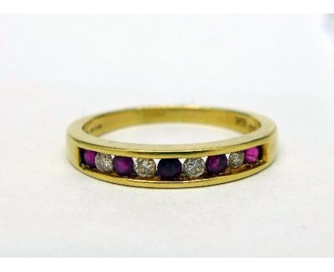 An 18ct gold, ruby and diamond eternity ring, weight 4g, size R