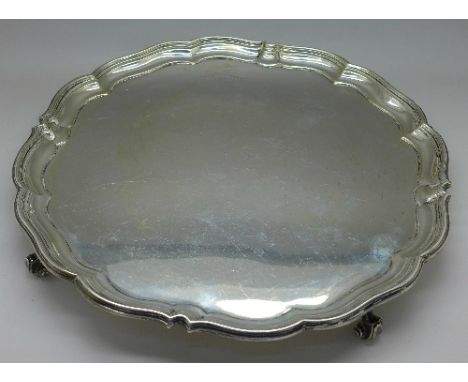 A silver salver, worn Sheffield hallmark, weight 936g, 30oz, diameter 30cm