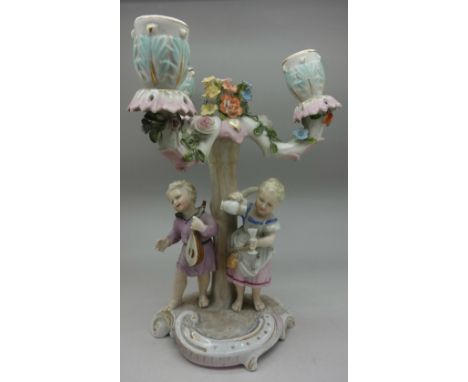 A continental figural three arm candlestick