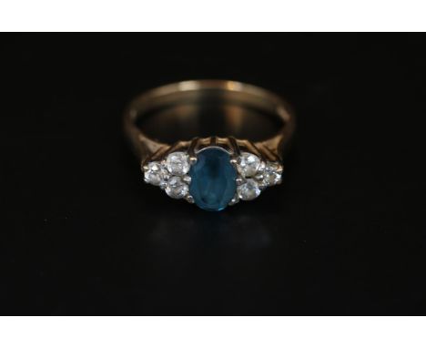 Ladies 9ct Gold Blue Topaz and Diamond set ring with open mount Size K. 2.2g total weight 