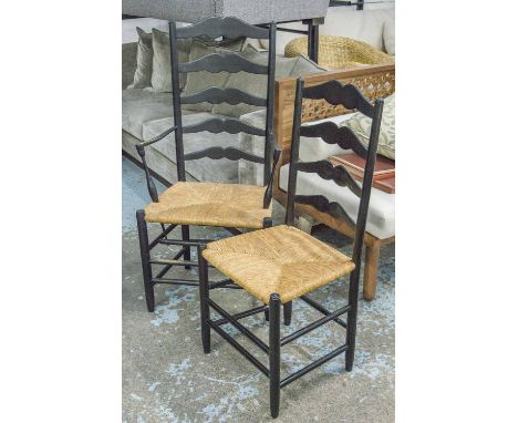 DINING CHAIRS, a set of eight, including two armchairs, ebonised ash with ladder backs and rush seats. (8)