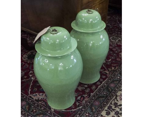 TEMPLE JARS, a pair, Chinese leaf green ceramic ginger jar form with lids, 53cm H. (2)