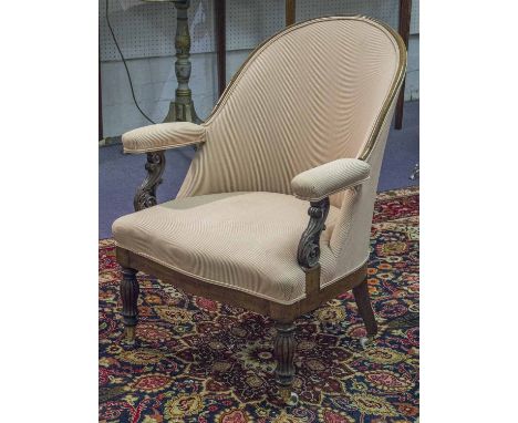 ARMCHAIR, mid 19th century mahogany in striped fabric with leaf carved arms and ceramic castors.