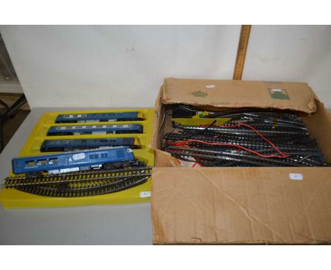 Box of 00 gauge model railway rolling stock together with various track and accessories