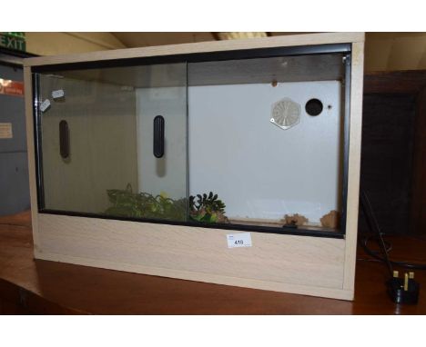 Small vivarium with light wood finish case