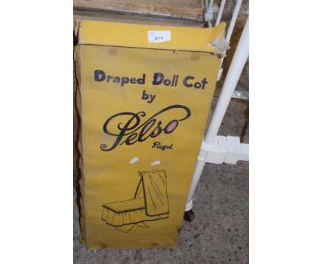 A draped doll cot