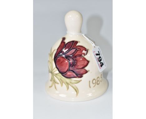 A MOORCROFT POTTERY 1985 YEAR BELL, with a tube lined Anemone pattern on a cream ground, painted marks inside, height 11cm (1