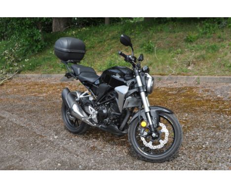 A 2018 HONDA CBF 300 N-A MOTORCYCLE in black with a 286cc petrol engine, six speed manual gearbox, V5C present, 3 previous ke