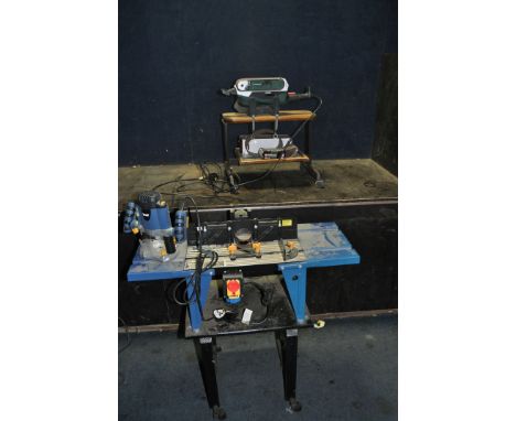 A WOLF ROUTER TABLE, with kill switch and mounted on a bespoke stand, a Wolf Router and a Parkside belt sander on bespoke sta