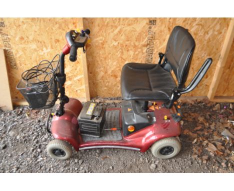 A STERLING PEARL MOBILITY SCOOTER with one key, front rack, charger, a car battery (PAT pass and working but battery doesn't 