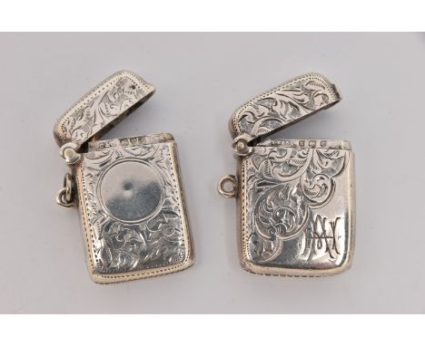 TWO SILVER VESTA CASES, both of a rectangular form, foliate patterns, one with engraved cartouche the other vacant cartouche,