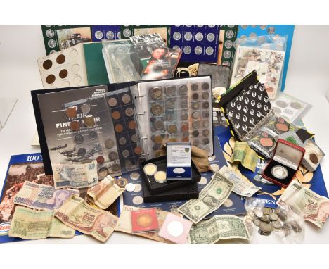 A CARDBOARD BOX AND PLASTIC STORAGE TUB OF COINS AND COMMEMORATIVES, to include an album of mixed coins some Silver content, 