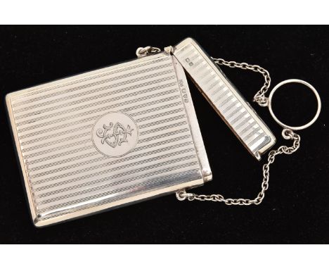 AN EARLY 20TH CENTURY SILVER CIGARETTE CASE, of a rectangular form, engine turned pattern with engraved monogram, hinged cove