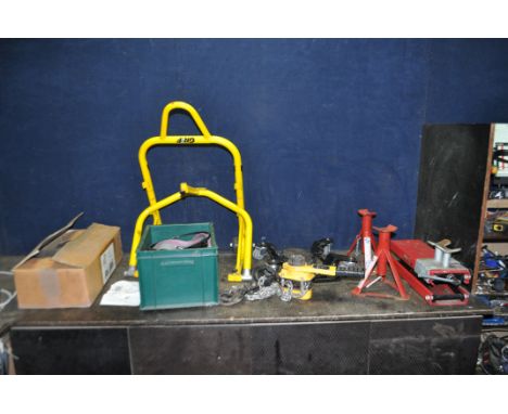 A COLLECTION OF MOTORCYCLE LIFTING EQUIPMENT, including a Grip paddock stand, a pair of Paddy Hopkirk axle stands, a boxed bu