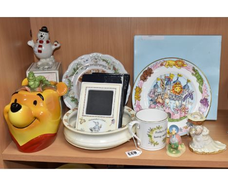A GROUP OF CHILDHOOD THEMED CERAMICS to include a Cardew 'Winnie the Pooh' novelty tea pot, a boxed Halcyon Days Porcelain 'T
