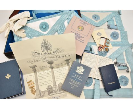 AN ASSORTMENT OF MASONIC REGALIA, a briefcase containing a books and pamphlets, three medals, gloves and three aprons, book o