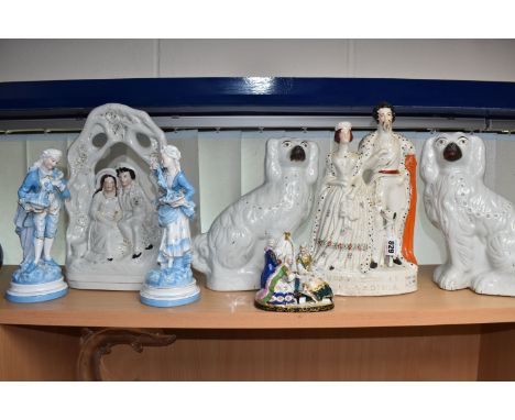 A COLLECTION OF NINETEENTH CENTURY MOSTLY STAFFORDSHIRE POTTERY ORNAMENTS to include a flatback sculpture of Queen Victoria a