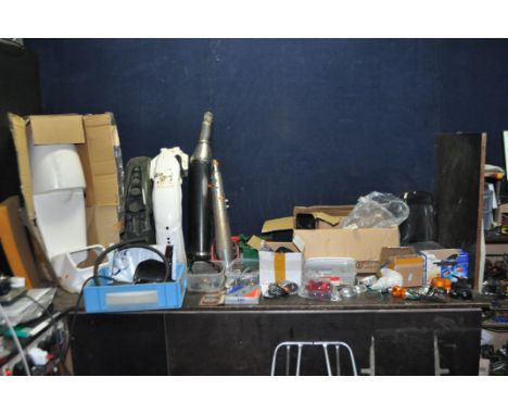 A COLLECTION OF VINTAGE AND MODERN MOTORCYCLE PARTS, including a Triumph exhaust, a new in box Cafe Racer seat cowl, two used