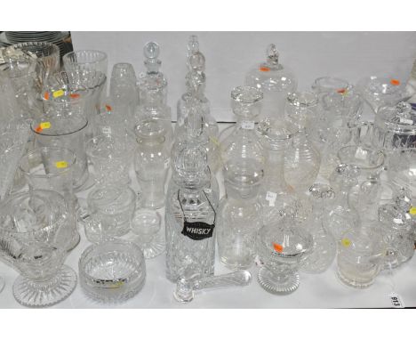 A LARGE GROUP OF CUT GLASSWARE, to include decanters, condiment sets, covered jars, powder bowls, vases, perfume atomisers et