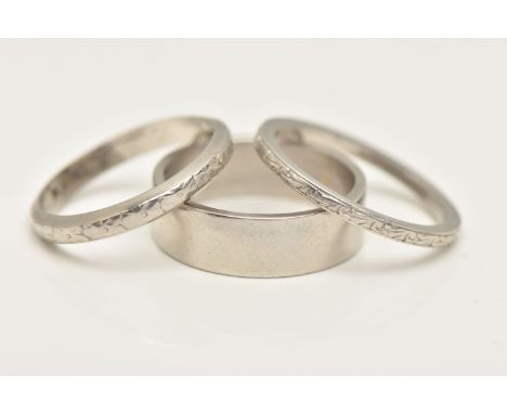 A PLATINUM RING AND TWO WHITE METAL RINGS, the first a plain flat profile ring, hallmarked Birmingham, ring size M centre, ap