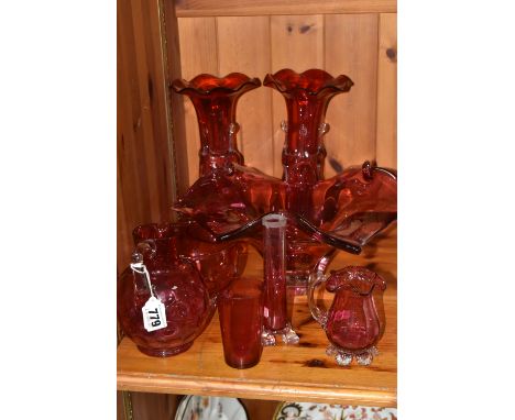 A COLLECTION OF EIGHT PIECES OF CRANBERRY GLASS comprising a large bowl with a flared rim diameter 34cm, a pair of vases with