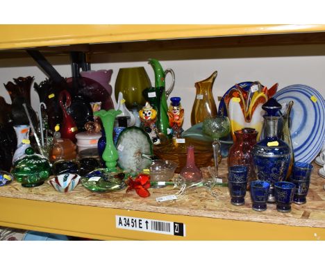 A GROUP OF COLOURED GLASSWARE, approximately forty pieces of vintage coloured glass, comprising Murano style clown figures, v