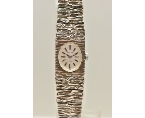 A LADIES SILVER 'ACCURIST' WRISTWATCH, manual wind, oval silvered dial signed 'Accurist', baton markers, in a bark effect cas