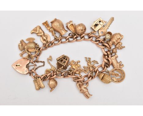 A ROSE METAL CHARM BRACELET, curb link bracelet fitted with a heart padlock clasp stamped 9ct, with additional safety chain, 