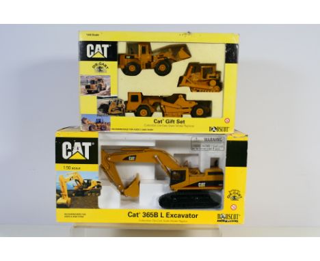 Norscot - 2 x boxed construction vehicle sets, a Cat 365B L excavator in 1:50 scale and a Cat gift set in 1:64 scale. They ar