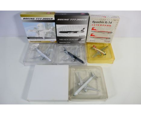 PHOENIX MODELS - 4 x models comprising 1:400 scale 777-300/ER in Singapore Airlines Star Alliance livery 9V-SWI, 1:400 scale 