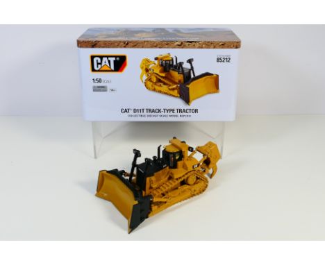 Diecast Masters - A collectors edition Cat D11T tracked tractor in 1:50 scale in a special collectors tin. # 85212. The model
