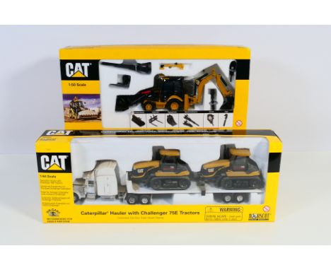 Norscot - 2 x boxed construction vehicle sets, a Cat 423E side shift back hoe loader in 1:50 scale and a Caterpillar hauler w