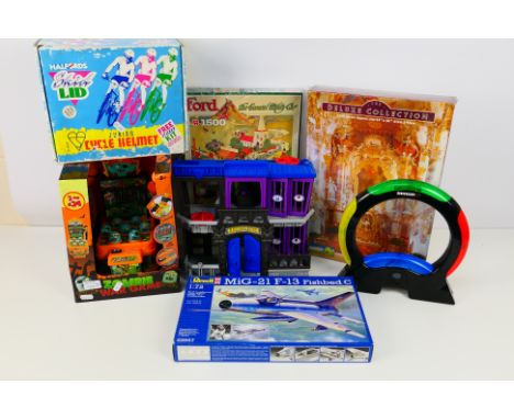 Mattel DC Comics - A mixed lot to include a Mattel Gotham City Jail, Simon Air electronic game, Revell 1/72 scale model kit, 