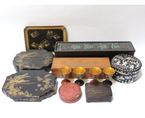 Three Japanese lacquer dressing table boxes, a cinnabar lacquer box, a mother of pearl inlaid box, a carved bamboo and a Chin